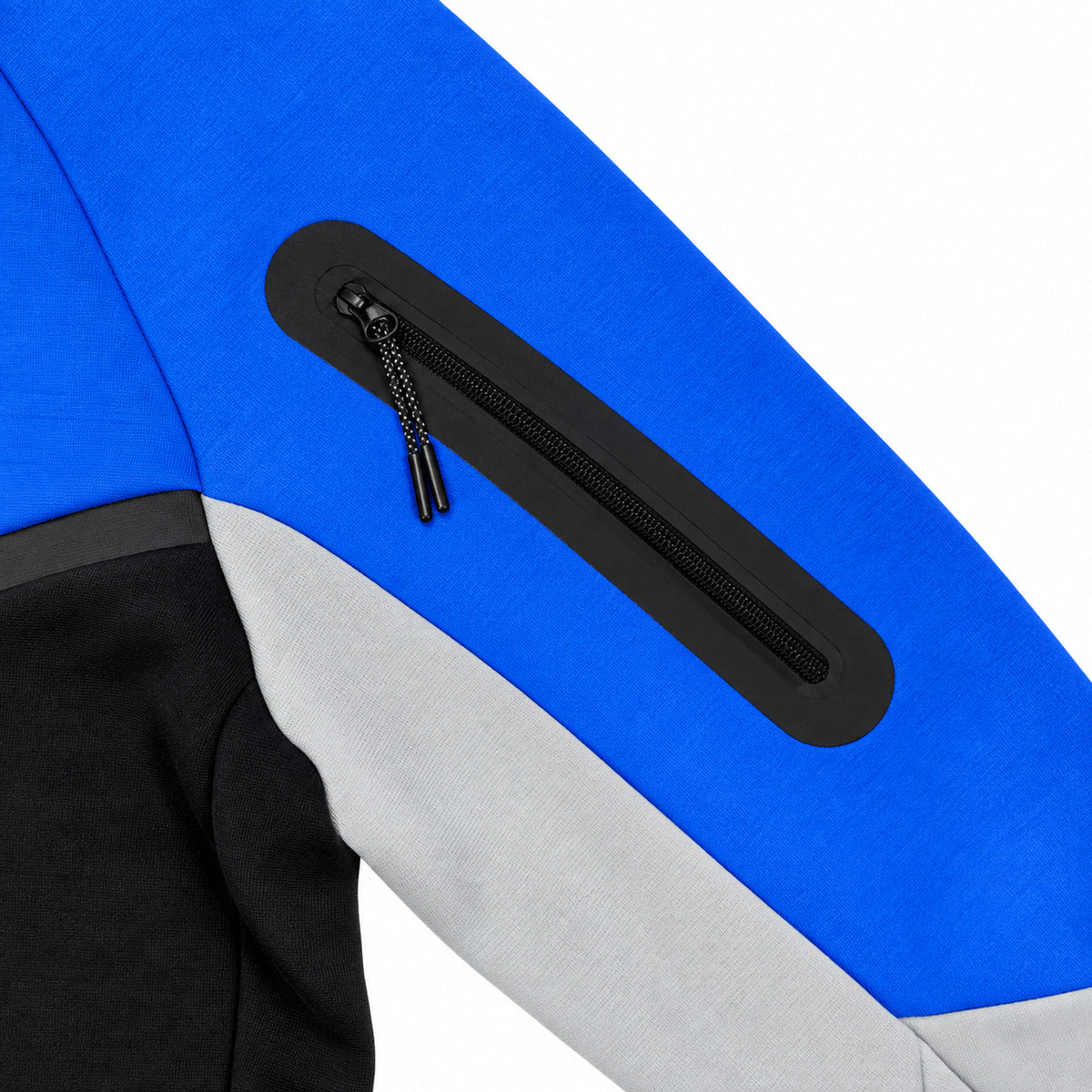 Polerón Nike Tech azul, negro y gris con cierre — detalle del cierre del bolsillo en la manga